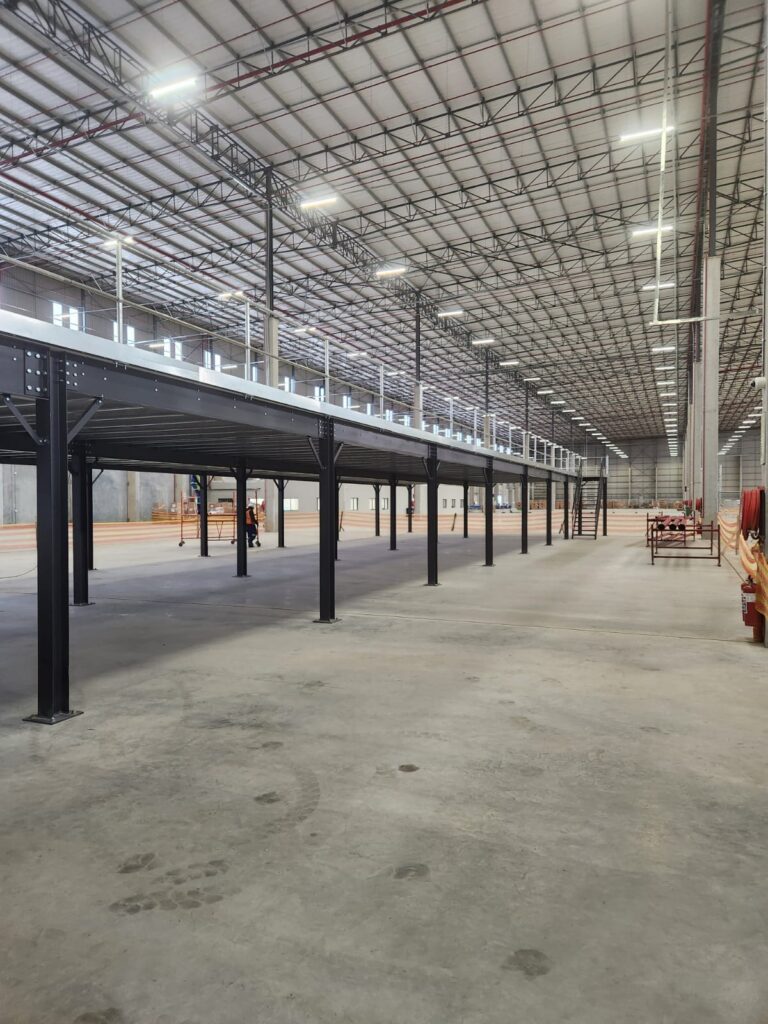 Mezzanine flooring in fashion retail warehouse for optimised storage.