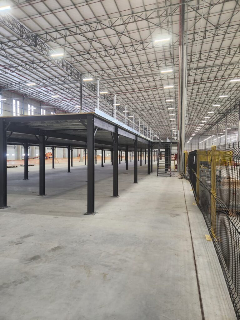 Industrial mezzanine with railings and staircase.