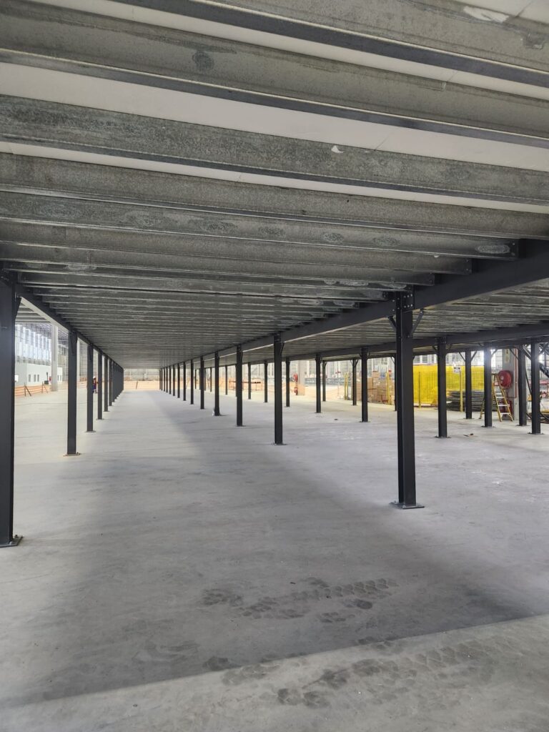 Underside of structural mezzanine showing support beams.