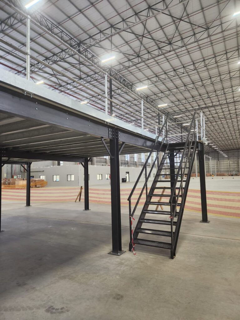 Steel mezzanine with staircase, increasing fashion warehouse capacity
