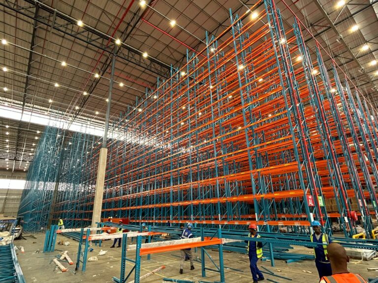 Very Narrow Aisle Racking Orange and Blue halway through installations